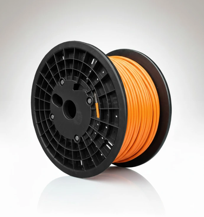 Large plastic reel with orange cable on display